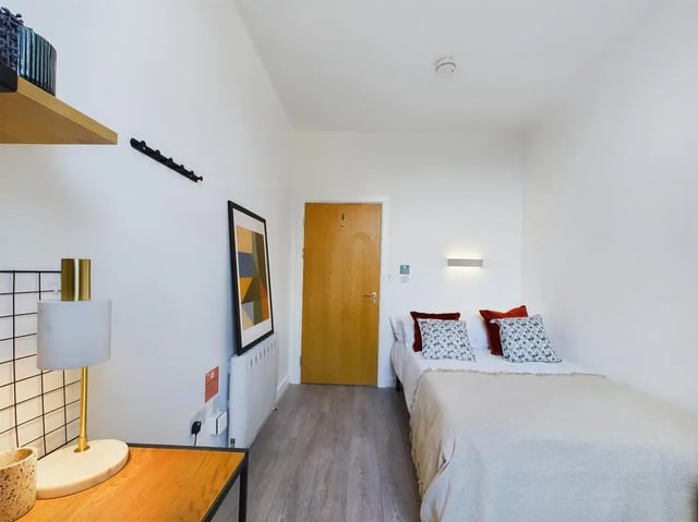 Bed desk art door radiator bedroom at 5 Bedroom House at Flat 4, 18, China Street in Lancaster Student Accommodation