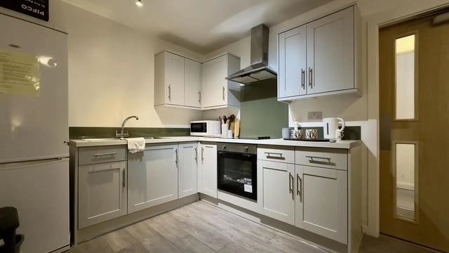 Modern kitchen with light grey cabinets and appliances kitchen at 4 Bedroom House at Flat 8, 18, China Street in Lancaster Student Accommodation