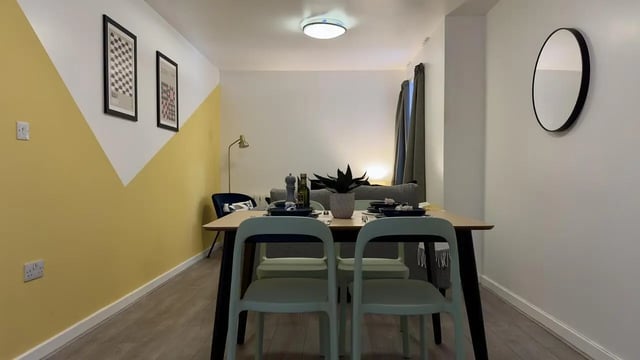 Dining table with chairs and plant Living Room at 4 Bedroom House at Flat 8, 18, China Street in Lancaster Student Accommodation