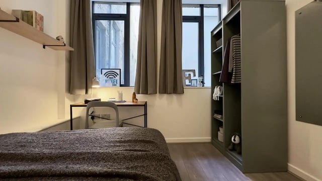 Bed desk chair wardrobe and shelves bedroom at 4 Bedroom House at Flat 8, 18, China Street in Lancaster Student Accommodation