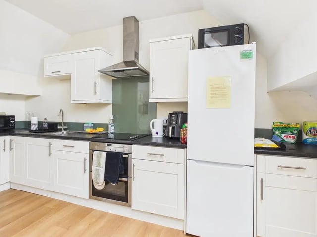 Fridge oven microwave cabinets with sink kitchen at 4 Bedroom House at Flat 9, 18, China Street in Lancaster Student Accommodation