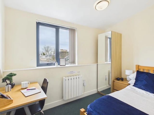 Desk with notebook and radiator bedroom at 4 Bedroom House at Flat 9, 18, China Street in Lancaster Student Accommodation