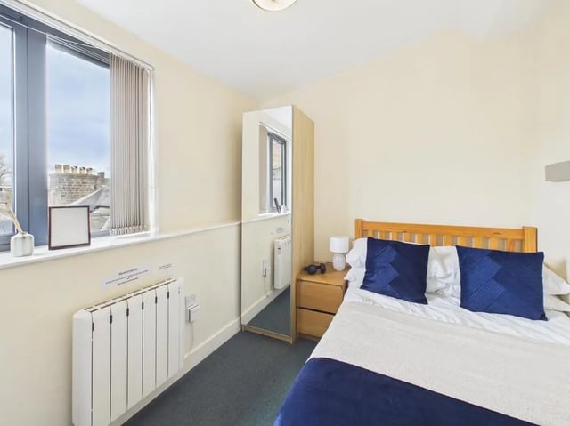 Bed side table lamp wardrobe mirror radiator bedroom at 4 Bedroom House at Flat 9, 18, China Street in Lancaster Student Accommodation
