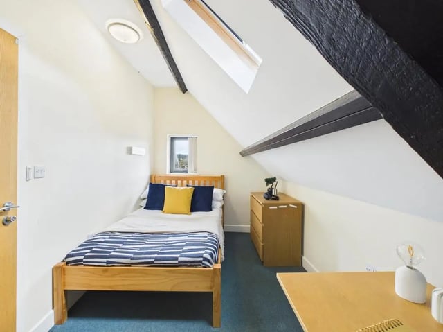 Bed dresser desk lamp small window bedroom at 4 Bedroom House at Flat 9, 18, China Street in Lancaster Student Accommodation