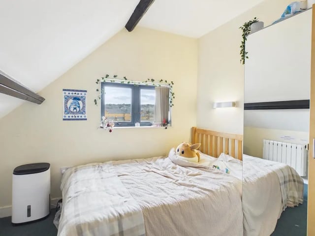 Bed and window with plush toy bedroom at 4 Bedroom House at Flat 9, 18, China Street in Lancaster Student Accommodation
