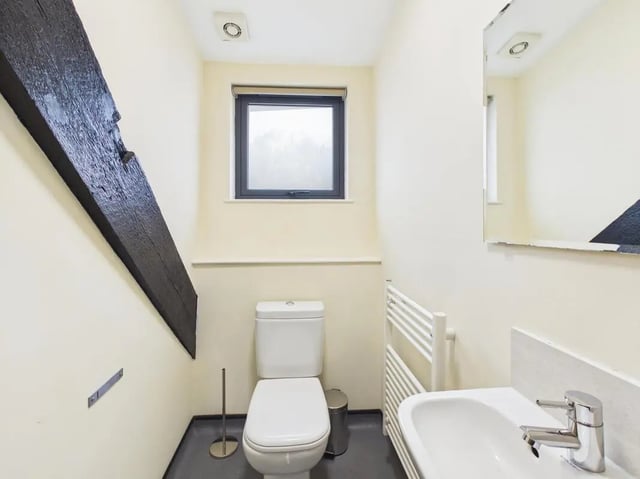 Toilet sink towel rail dark beam bathroom at 4 Bedroom House at Flat 9, 18, China Street in Lancaster Student Accommodation
