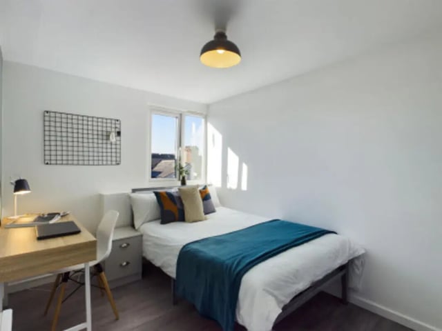 Bed desk chair grid wall window bedroom at 9 Bedroom House at 128, Uttoxeter New Road in Derby Student Accommodation
