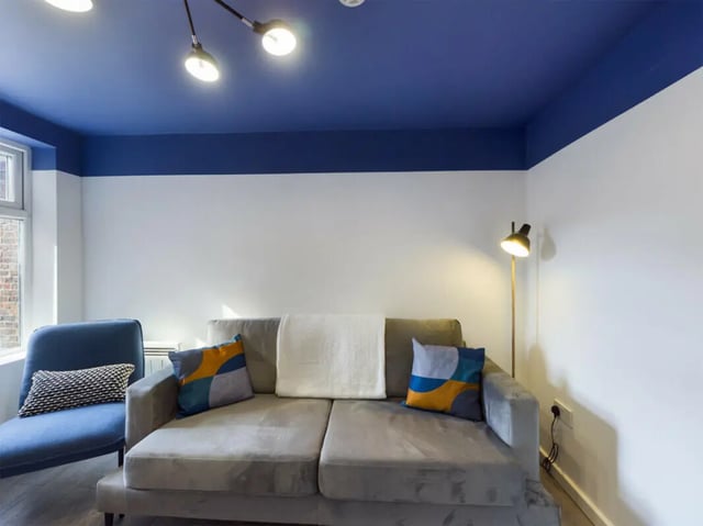 Sofa chair lamp with blue ceiling Living Room at 4 Bedroom House at 75, Saxony Road in Liverpool Student Accommodation