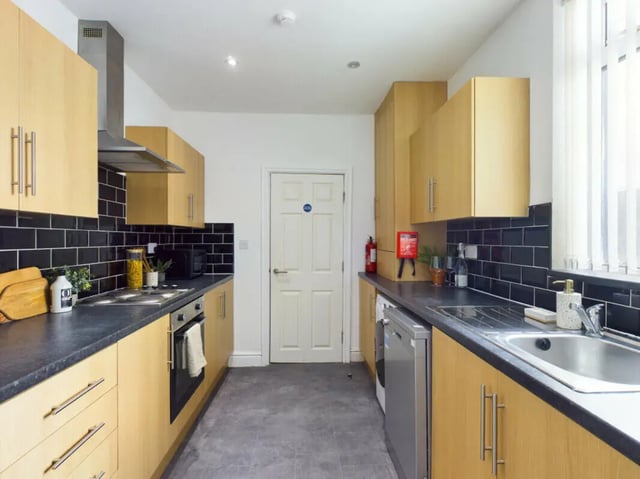 Light wood cabinets black backsplash sink kitchen at 4 Bedroom House at 7, Westbourne Grove in Lincoln Student Accommodation