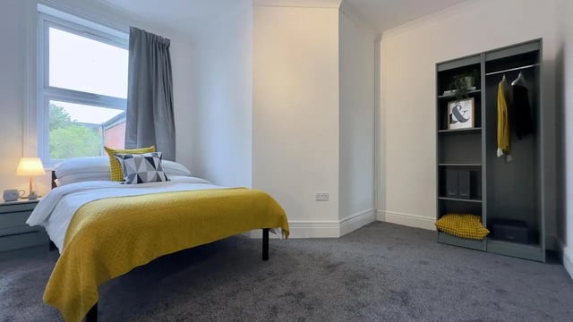 Bed wardrobe and bedside table bedroom at 6 Bedroom House at 214, West Parade in Lincoln Student Accommodation