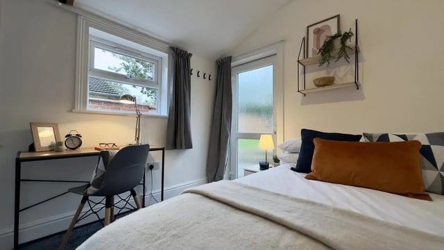 Desk chair bed lamp art and shelving bedroom at 6 Bedroom House at 214, West Parade in Lincoln Student Accommodation