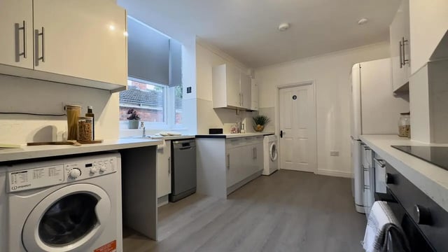 Washing machine dishwasher white cabinets kitchen at 6 Bedroom House at 214, West Parade in Lincoln Student Accommodation