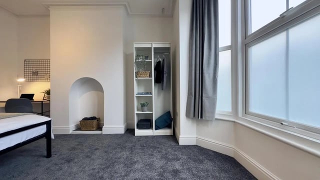 Bed desk wardrobe and fireplace bedroom at 6 Bedroom House at 214, West Parade in Lincoln Student Accommodation