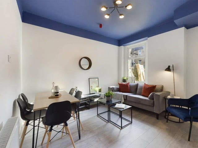 Dining table grey sofa coffee tables living room at 6 Bedroom House at 6, Milking Stile Lane in Lancaster Student Accommodation