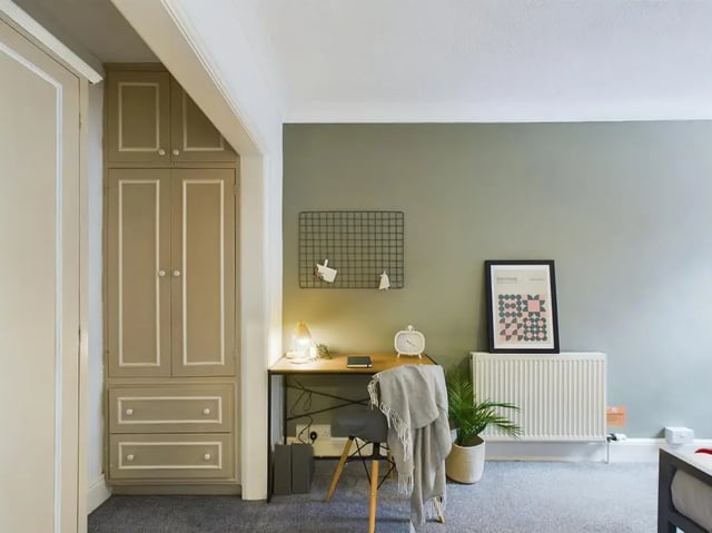 Desk chair radiator poster and wardrobe study area at 4 Bedroom House at 11, Charles Street West in Lincoln Student Accommodation