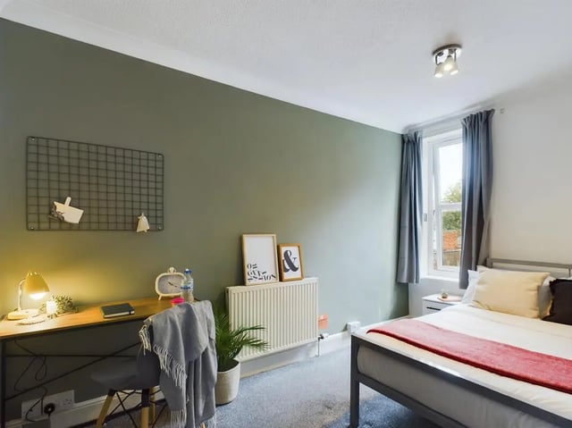 Desk chair bed and radiator bedroom at 4 Bedroom House at 11, Charles Street West in Lincoln Student Accommodation