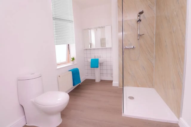 Toilet sink shower towels and radiator bathroom at 5 Bedroom House at 99, Monks Road in Lincoln Student Accommodation