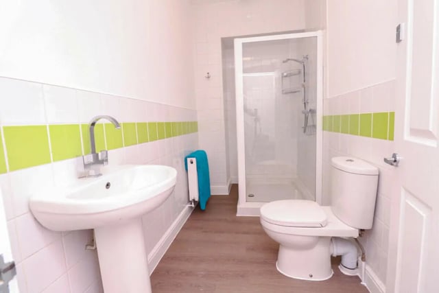 Sink toilet shower cubicle blue towel bathroom at 5 Bedroom House at 99, Monks Road in Lincoln Student Accommodation