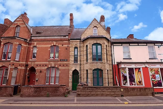 Townhouses with shops below exterior at 5 Bedroom House at 99, Monks Road in Lincoln Student Accommodation
