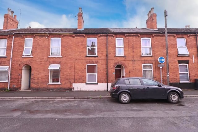 Terraced brick houses with car exterior at 4 Bedroom House at 86, Cross Street in Lincoln Student Accommodation