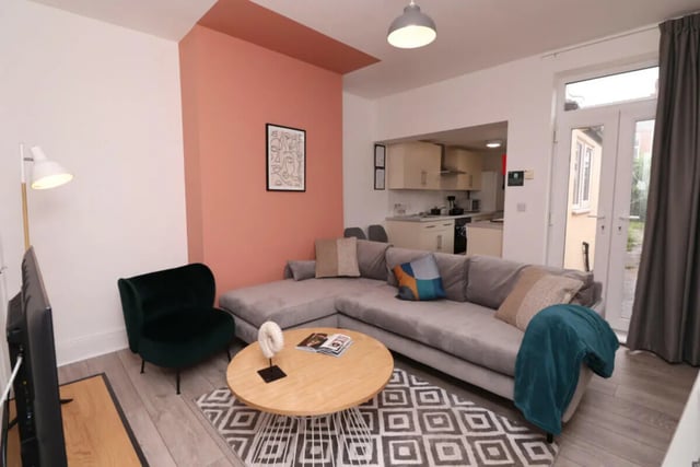 Lounge with sectional sofa and round coffee table living room at 5 Bedroom House at 43, Thesiger Street in Lincoln Student Accommodation