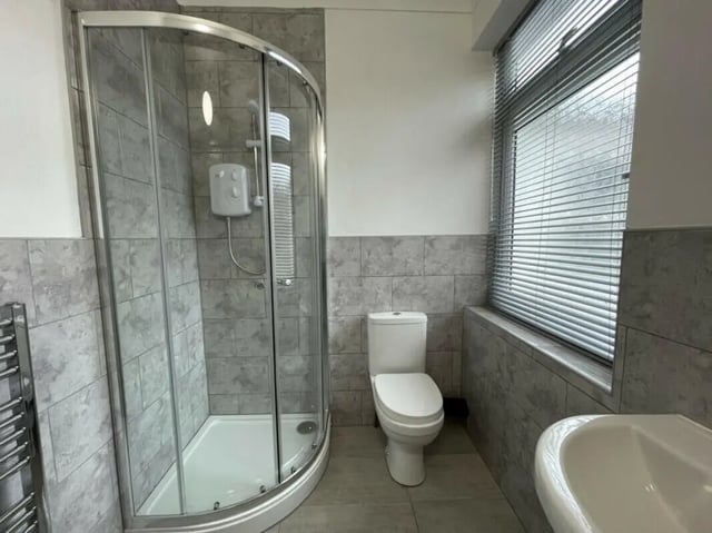 Shower cubicle toilet sink towel rail bathroom at 2 Bedroom House at 20 A, Portland Street in Lincoln Student Accommodation
