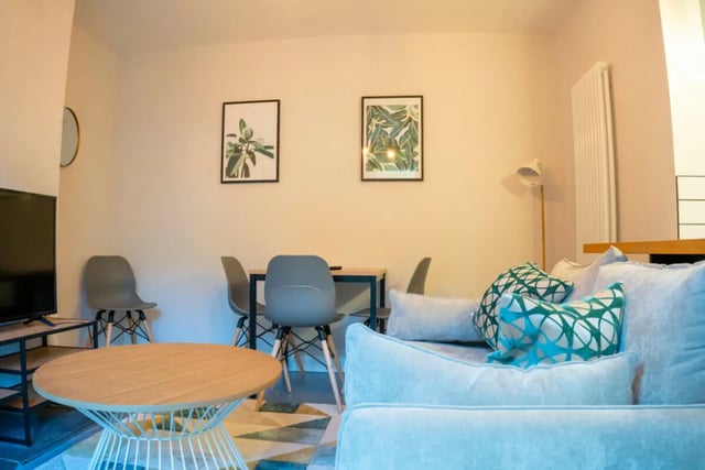 Sofa table chairs artwork wall mounted radiator living room at 4 Bedroom House at 16, Kelsey Street in Lancaster Student Accommodation