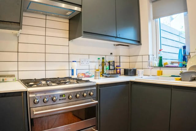 Stainless steel oven with dark cabinets kitchen area at 4 Bedroom House at 16, Kelsey Street in Lancaster Student Accommodation