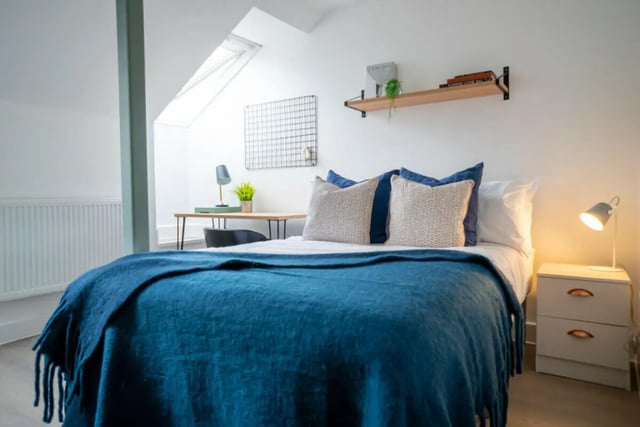 Bed pillows desk lamp bedside table bedroom at 3 Bedroom House at Flat 2, 331, Dickenson Road in Manchester Student Accommodation