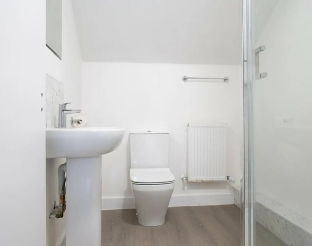 Sink toilet radiator shower enclosure bathroom at 3 Bedroom House at Flat 2, 331, Dickenson Road in Manchester Student Accommodation
