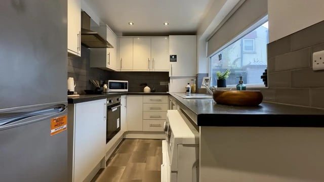 Refrigerator microwave oven cabinets countertops kitchen at 3 Bedroom House at 25, Romney Street in Salford Student Accommodation