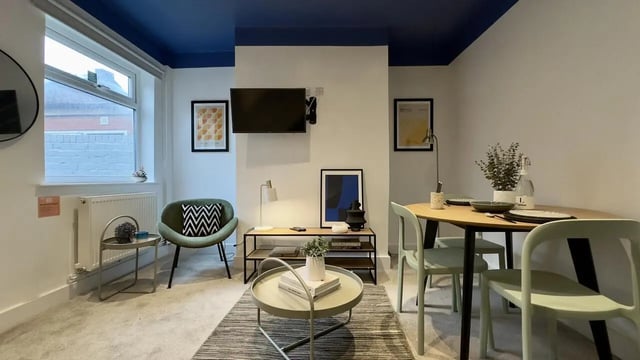Chair TV stand coffee table dining table living room at 3 Bedroom House at 25, Romney Street in Salford Student Accommodation