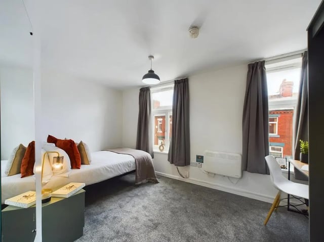 Bed with pillows lamp desk chair bedroom at 7 Bedroom House at 6, KIPPAX STREET in Manchester Student Accommodation