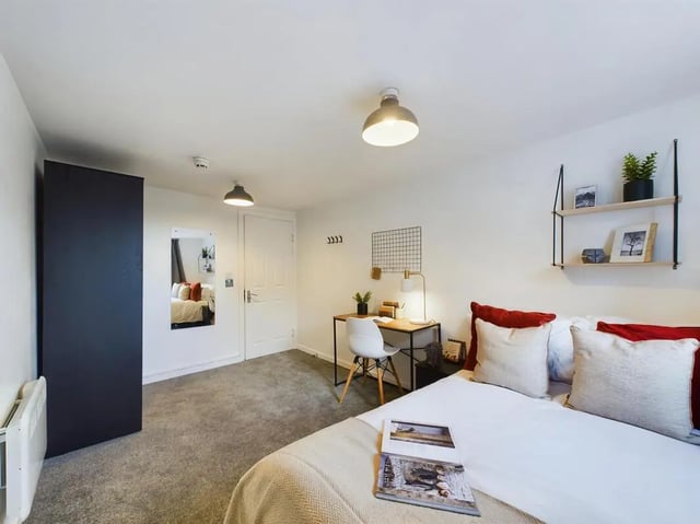 Bed desk shelves mirror door radiator bedroom at 7 Bedroom House at 6, KIPPAX STREET in Manchester Student Accommodation