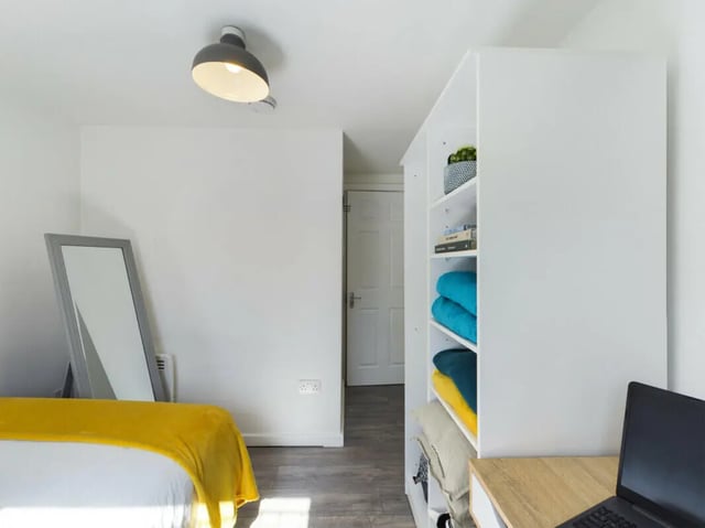 Mirror bed white shelves folded towels bedroom at 4 Bedroom House at Flat 1 30, Haydn Avenue in Manchester Student Accommodation