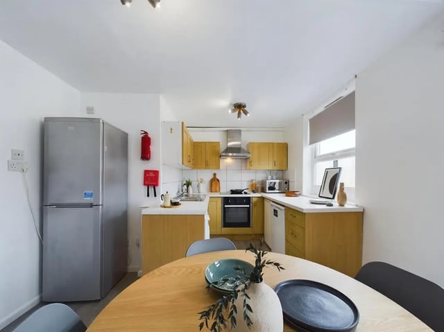 Refrigerator fire extinguisher cabinets oven kitchen at 4 Bedroom House at Flat 1, 58, Ruskin Avenue in Manchester Student Accommodation
