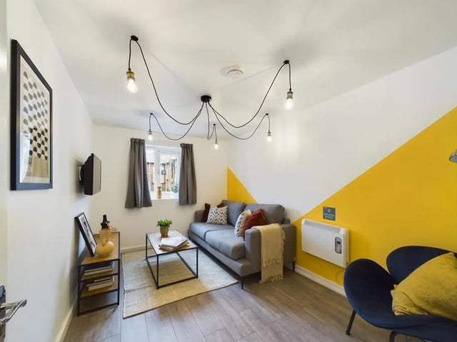 Sofa coffee table and artwork living room at 4 Bedroom House at Flat 1, 58, Ruskin Avenue in Manchester Student Accommodation