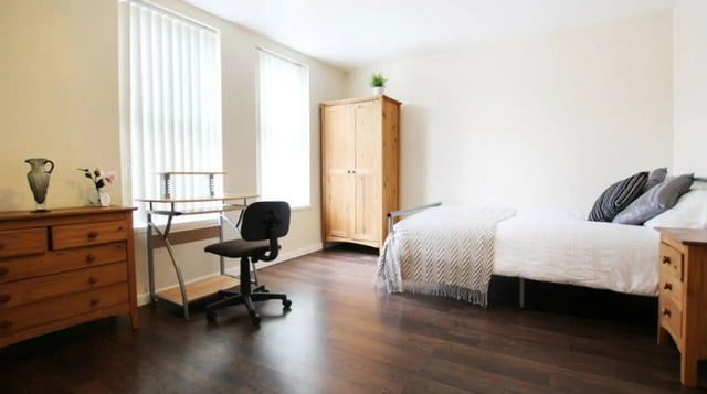 Bed desk wardrobe and dresser bedroom. at 6 Bedroom House at 5, ASHFIELD ROAD in Manchester Student Accommodation