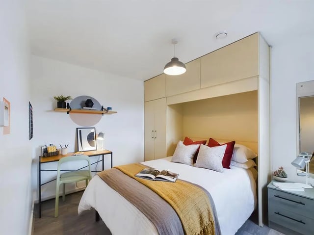 Bed study area with desk and shelves bedroom at 6 Bedroom House at 174, ACOMB STREET in Manchester Student Accommodation