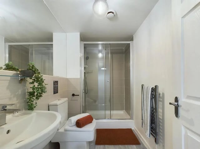 Sink toilet shower towels and mat bathroom at 6 Bedroom House at 174, ACOMB STREET in Manchester Student Accommodation