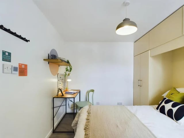 Desk chair and bed with built-in wardrobe bedroom at 6 Bedroom House at 174, ACOMB STREET in Manchester Student Accommodation