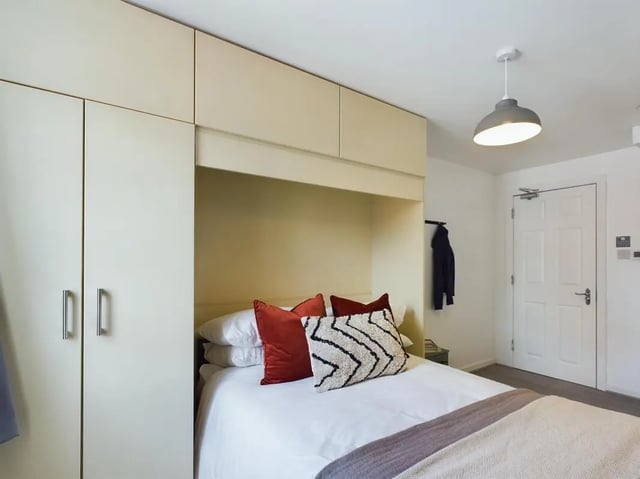 Bed wardrobe pillows and closet bedroom at 6 Bedroom House at 174, ACOMB STREET in Manchester Student Accommodation
