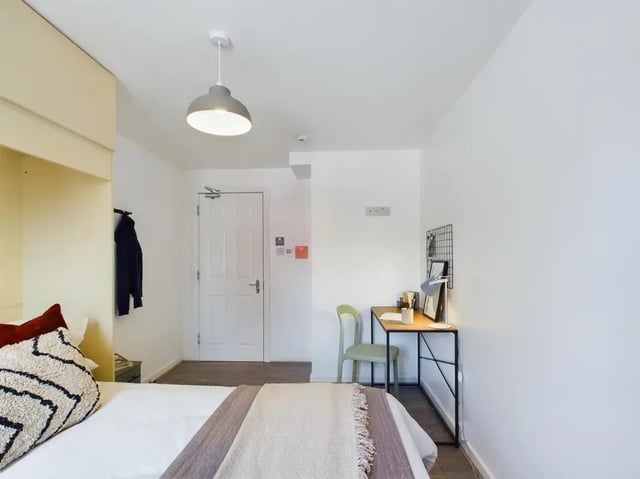 Bed desk chair and door bedroom at 6 Bedroom House at 174, ACOMB STREET in Manchester Student Accommodation