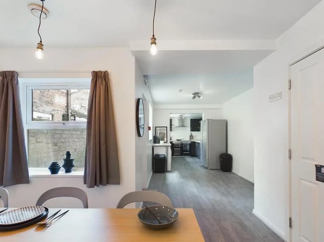 Dining area with kitchen and fridge Kitchen area at 6 Bedroom House at 174, ACOMB STREET in Manchester Student Accommodation