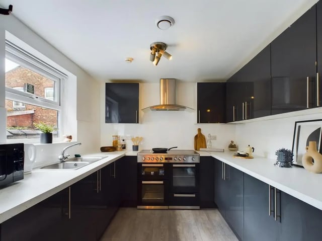 Modern U-shaped kitchen with stainless steel appliances kitchen at 6 Bedroom House at 174, ACOMB STREET in Manchester Student Accommodation