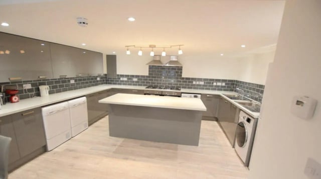 Modern kitchen with island appliances and washing machines kitchen at 10 Bedroom House at 15, Monks Road in Lincoln Student Accommodation