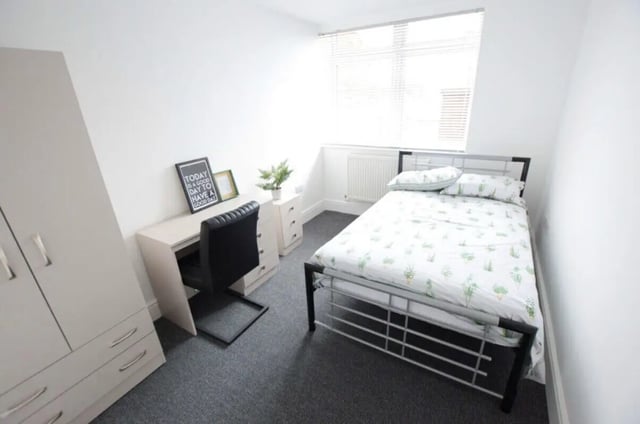 Wardrobe desk chair and bed student bedroom at 10 Bedroom House at 15, Monks Road in Lincoln Student Accommodation