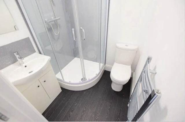 Sink shower toilet and towel rail bathroom at 10 Bedroom House at 15, Monks Road in Lincoln Student Accommodation