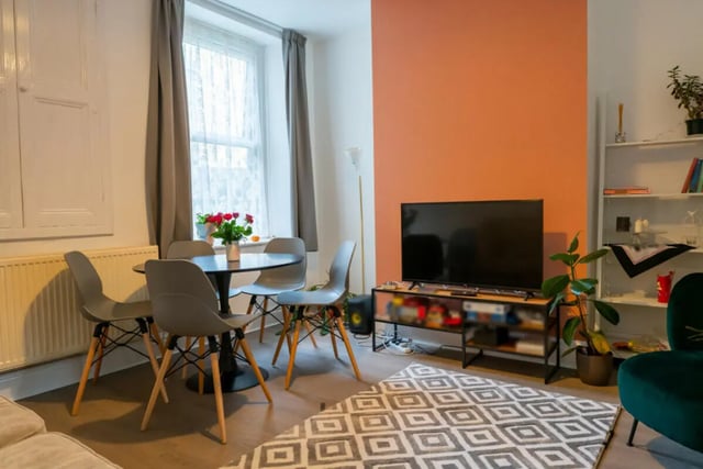 Dining table chairs television shelves living room at 5 Bedroom House at 38, Cavendish Street in Lancaster Student Accommodation