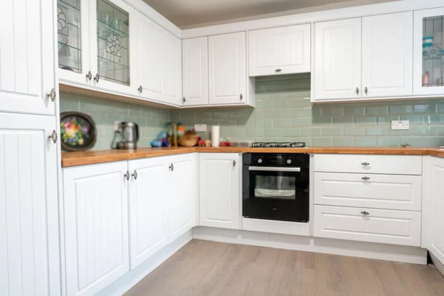 White cabinets oven stove tile backsplash kitchen at 5 Bedroom House at 38, Cavendish Street in Lancaster Student Accommodation